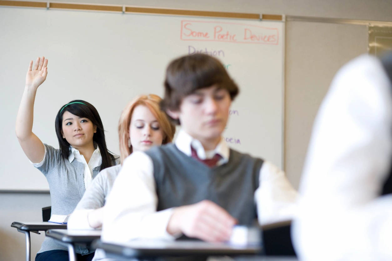 Girl student raising hand