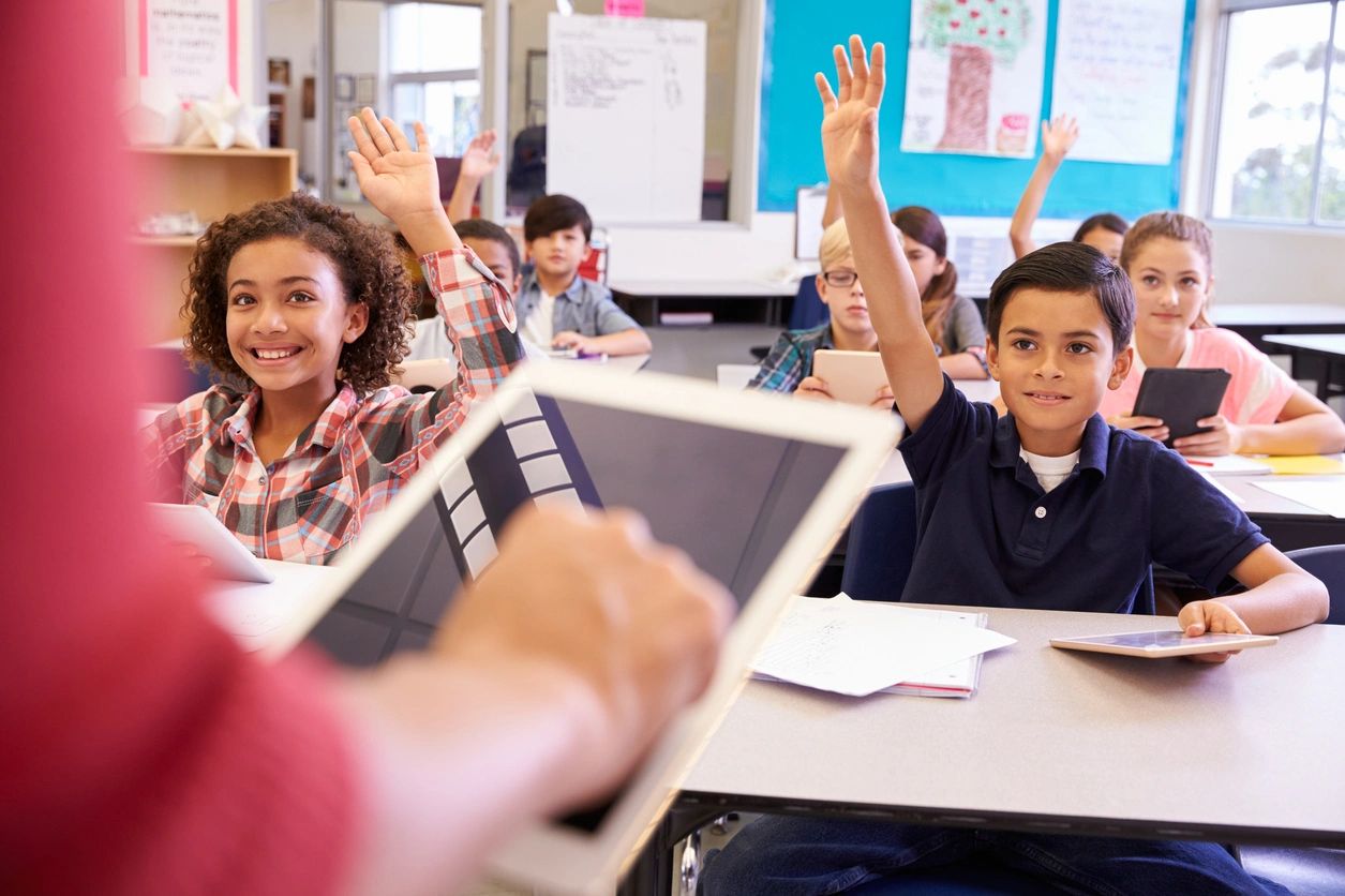 Kids actively raising hands