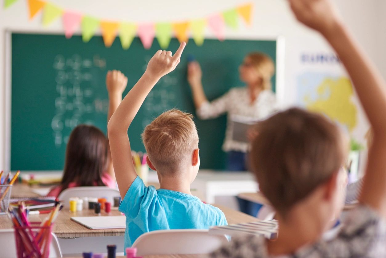 Kids raising hands